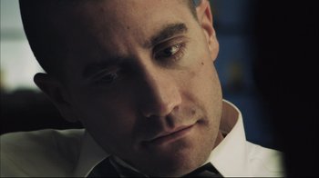 Movie still from “End of Watch” (2012), directed by David Ayer – A person wearing a shirt and bow tie; Close Up shot, Low angle