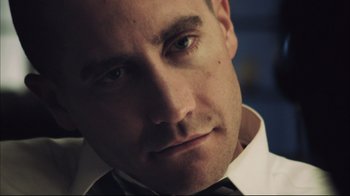 Movie still from “End of Watch” (2012), directed by David Ayer – A person wearing a shirt and bow tie; Close Up shot, Low angle