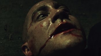Movie still from “End of Watch” (2012), directed by David Ayer – A man's face with blood on it; Extreme Close Up shot, Overhead angle