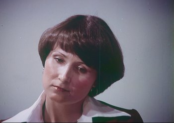 Movie still from “Enforcer from Death Row” (1976), directed by Efren C. Piñon – A person wearing a white shirt; Close Up shot, High angle