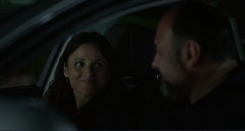 Movie still from “Enough Said” (2013), directed by Nicole Holofcener – A man and a woman sitting in a car at night; Close Up shot, Over the shoulder angle
