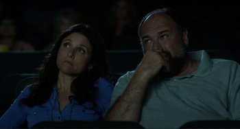Movie still from “Enough Said” (2013), directed by Nicole Holofcener – A man and a woman sitting next to each other; Close Up shot, Low angle