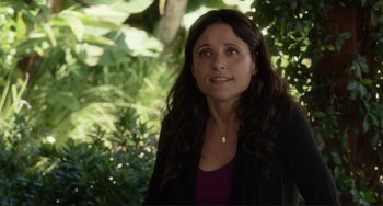 Movie still from “Enough Said” (2013), directed by Nicole Holofcener – A person with long hair; Close Up shot, Over the shoulder angle