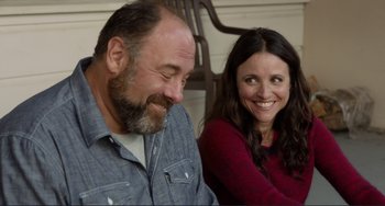 Movie still from “Enough Said” (2013), directed by Nicole Holofcener – A man and a woman sitting next to each other; Close Up shot, Over the shoulder angle