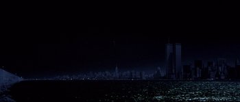 Movie still from “Escape from New York” (1981), directed by John Carpenter – A view of a city skyline at night from the ocean; Extreme Wide shot, Low angle