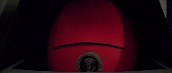 Movie still from “Escape from New York” (1981), directed by John Carpenter – View of the presidential seal on the back of a car; Extreme Close Up shot, Low angle