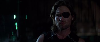 Movie still from “Escape from New York” (1981), directed by John Carpenter – A person wearing a eye patch; Close Up shot, Low angle
