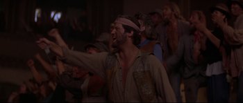 Movie still from “Escape from New York” (1981), directed by John Carpenter – A group of people standing in a room; Medium shot, Low angle