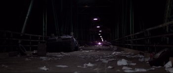Movie still from “Escape from New York” (1981), directed by John Carpenter – A car is parked in a dark parking lot; Extreme Wide shot, High angle