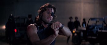 Movie still from “Escape from New York” (1981), directed by John Carpenter – A person with a eye patch; Close Up shot, Low angle
