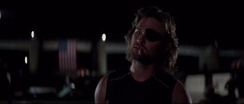 Movie still from “Escape from New York” (1981), directed by John Carpenter – A person wearing a eye patch; Close Up shot, Low angle