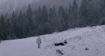 Movie still from “Essential Killing” (2010), directed by Jerzy Skolimowski – A man walking across a snow covered field; Extreme Wide shot, High angle