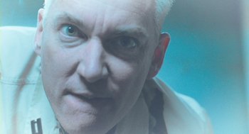 Movie still from “Essential Killing” (2010), directed by Jerzy Skolimowski – A person with a white hair; Extreme Close Up shot, Low angle
