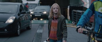 Movie still from “The Quake” (2018), directed by John Andreas Andersen – A young girl is walking down the street; Medium shot, Over the shoulder angle