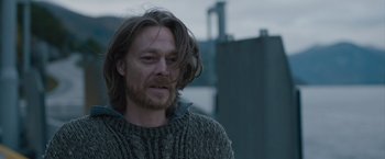 Movie still from “The Quake” (2018), directed by John Andreas Andersen – A person with long hair; Close Up shot, Over the shoulder angle