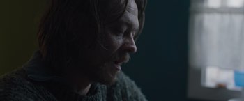 Movie still from “The Quake” (2018), directed by John Andreas Andersen – A person with long hair; Close Up shot, Over the shoulder angle