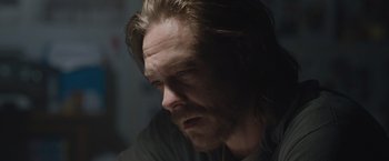 Movie still from “The Quake” (2018), directed by John Andreas Andersen – A person with long hair; Close Up shot, Over the shoulder angle