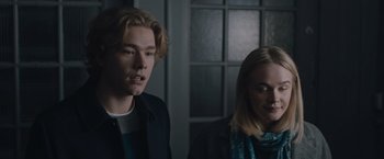 Movie still from “The Quake” (2018), directed by John Andreas Andersen – A man and a woman standing next to each other in a room; Close Up shot, Over the shoulder angle