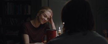 Movie still from “The Quake” (2018), directed by John Andreas Andersen – A woman sitting in front of a mirror with her hand on her forehead; Medium shot, Over the shoulder angle