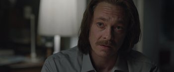 Movie still from “The Quake” (2018), directed by John Andreas Andersen – A person with long hair; Close Up shot, Over the shoulder angle