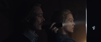 Movie still from “The Quake” (2018), directed by John Andreas Andersen – A man and a woman looking at each other; Close Up shot, Over the shoulder angle