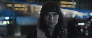 Movie still from “The Quake” (2018), directed by John Andreas Andersen – A person with long black hair; Close Up shot, Low angle