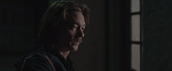 Movie still from “The Quake” (2018), directed by John Andreas Andersen – A person with long hair; Close Up shot, Over the shoulder angle
