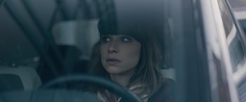 Movie still from “The Quake” (2018), directed by John Andreas Andersen – A woman sitting in a car looking out of the window; Close Up shot, Over the shoulder angle