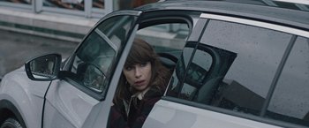 Movie still from “The Quake” (2018), directed by John Andreas Andersen – A woman sitting in the driver's seat of a car; Close Up shot, Over the shoulder angle