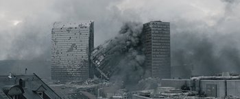 Movie still from “The Quake” (2018), directed by John Andreas Andersen – A building that has been destroyed by a fire; Extreme Wide shot, High angle