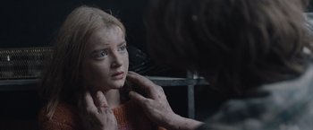 Movie still from “The Quake” (2018), directed by John Andreas Andersen – A young girl is looking into a mirror; Close Up shot, Over the shoulder angle