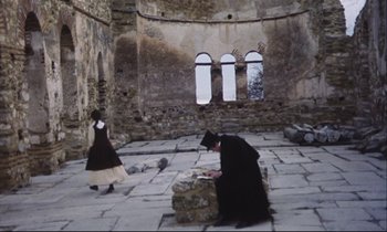 Movie still from “Eternity and a Day” (1998), directed by Theodoros Angelopoulos – A woman and a man dressed in medieval clothing; Extreme Wide shot, High angle