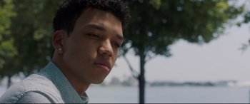 Movie still from “Every Day” (2018), directed by Michael Sucsy – A person with a tree in the background; Close Up shot, Low angle