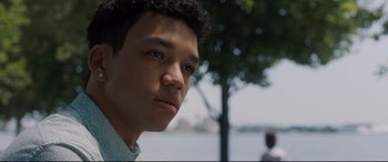 Movie still from “Every Day” (2018), directed by Michael Sucsy – A person with a tree in the background; Close Up shot, Low angle