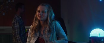 Movie still from “Every Day” (2018), directed by Michael Sucsy – A woman with long blonde hair sitting in a room; Close Up shot, Over the shoulder angle