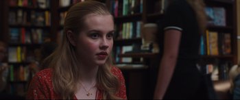 Movie still from “Every Day” (2018), directed by Michael Sucsy – A girl is sitting in a room with a book shelf in the background; Close Up shot, Over the shoulder angle