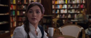 Movie still from “Every Day” (2018), directed by Michael Sucsy – A woman sitting at a table with a cup in front of her; Close Up shot, Over the shoulder angle