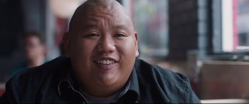 Movie still from “Every Day” (2018), directed by Michael Sucsy – A person smiling for the camera; Close Up shot, Low angle