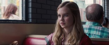 Movie still from “Every Day” (2018), directed by Michael Sucsy – A woman sitting in a chair looking at the camera; Close Up shot, Over the shoulder angle