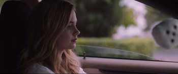 Movie still from “Every Day” (2018), directed by Michael Sucsy – A woman sitting in the driver's seat of a car; Close Up shot, Over the shoulder angle