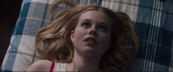 Movie still from “Every Day” (2018), directed by Michael Sucsy – A woman with long hair laying on the ground; Close Up shot, Overhead angle