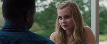 Movie still from “Every Day” (2018), directed by Michael Sucsy – A young woman is sitting in front of a man; Close Up shot, Over the shoulder angle