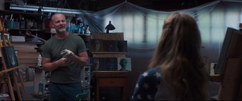 Movie still from “Every Day” (2018), directed by Michael Sucsy – A man and a woman in front of a painting; Medium shot, Over the shoulder angle