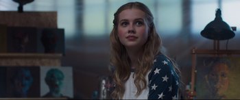 Movie still from “Every Day” (2018), directed by Michael Sucsy – A young woman with long hair wearing a white and blue shirt; Close Up shot, Over the shoulder angle