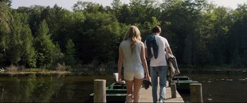 Movie still from “Every Day” (2018), directed by Michael Sucsy – A man and a woman walking across a dock; Wide shot, Low angle