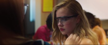 Movie still from “Every Day” (2018), directed by Michael Sucsy – A woman wearing glasses looking at the camera; Close Up shot, Over the shoulder angle