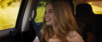 Movie still from “Every Day” (2018), directed by Michael Sucsy – A woman sitting in the driver's seat of a car; Close Up shot, Over the shoulder angle