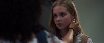 Movie still from “Every Day” (2018), directed by Michael Sucsy – A young girl sitting in front of a mirror; Close Up shot, Over the shoulder angle