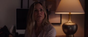 Movie still from “Every Day” (2018), directed by Michael Sucsy – A person sitting in front of a lamp; Close Up shot, Over the shoulder angle