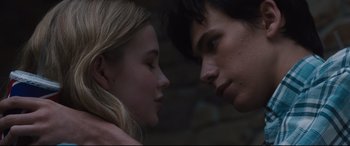 Movie still from “Every Day” (2018), directed by Michael Sucsy – A man and a woman face to face in front of a brick wall; Close Up shot, Low angle